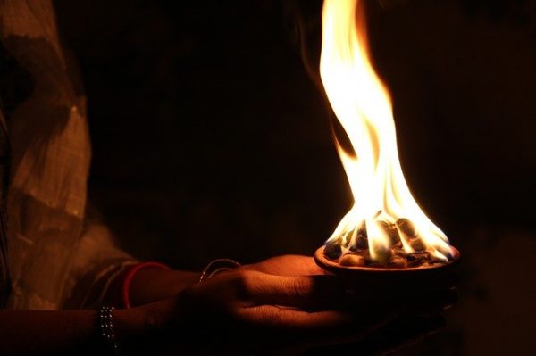 Woman holding fire sage