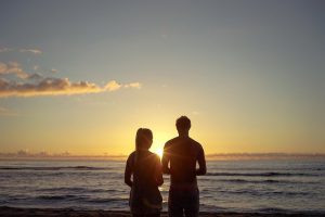 couples standing at beach