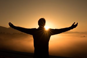 Boy relaxing front of sun