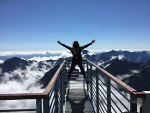 Girl standing at the top.
