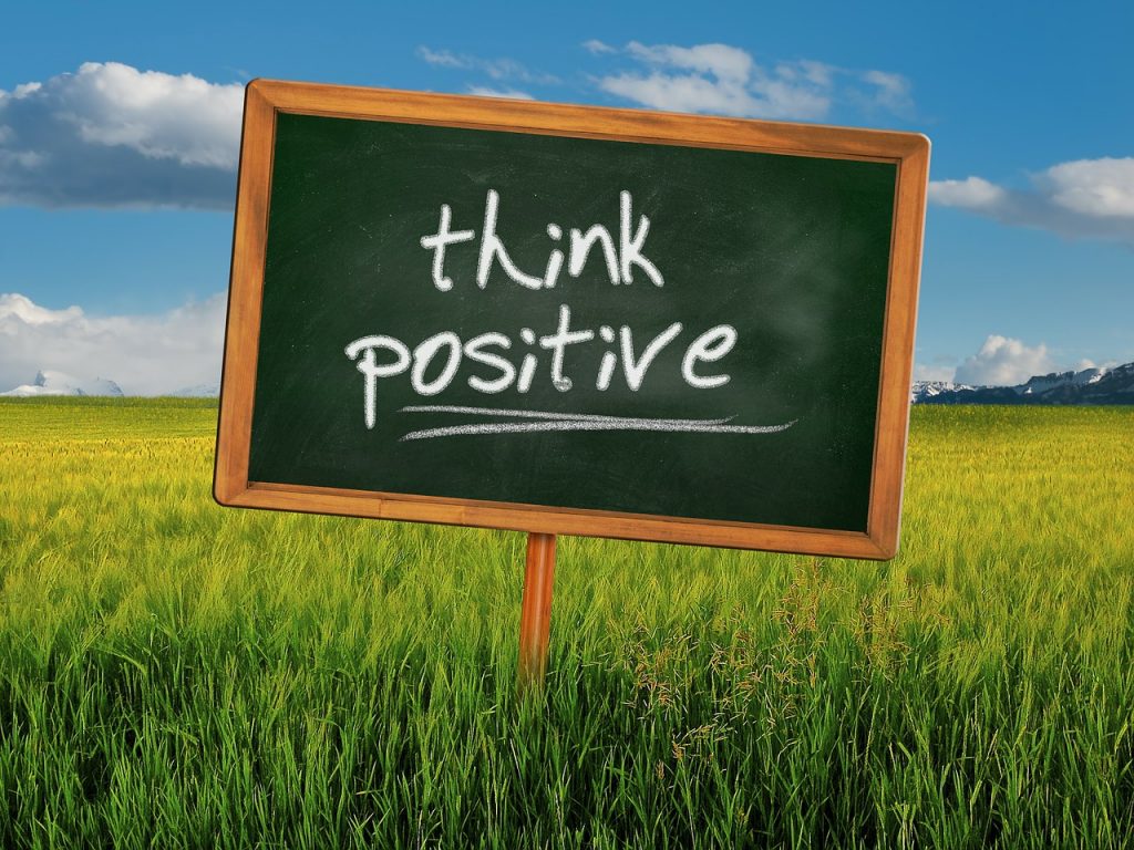 Think positive written on black board
