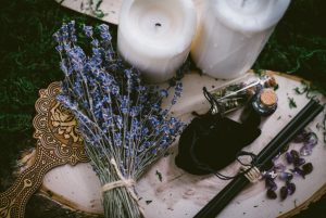 Blue grass wih candle and magic stick