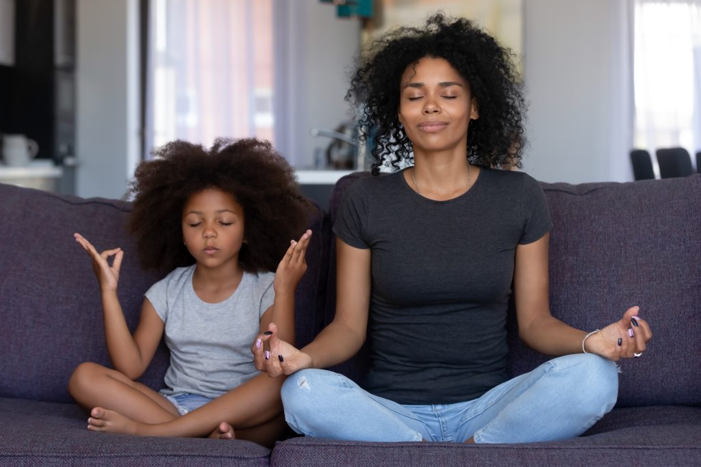 Mom & Daughter Meditating