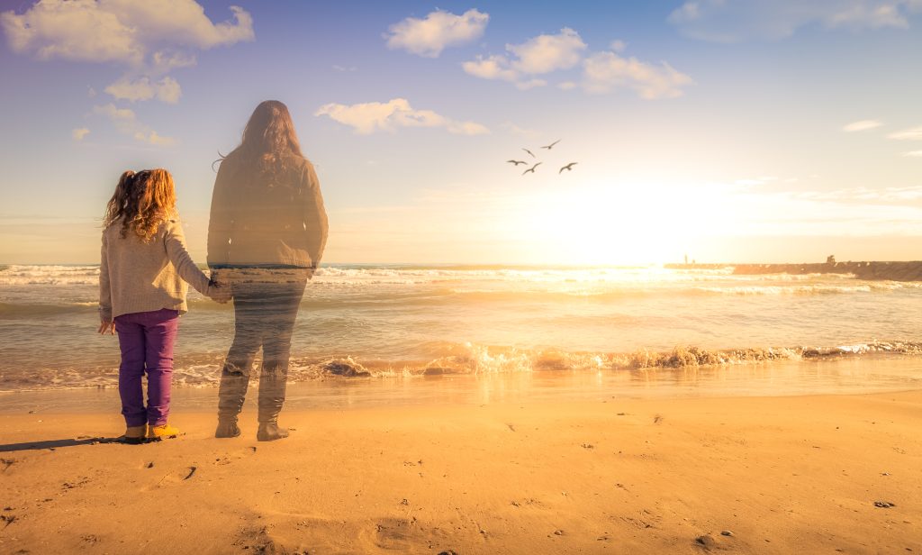 Mother And Daughter at Beach